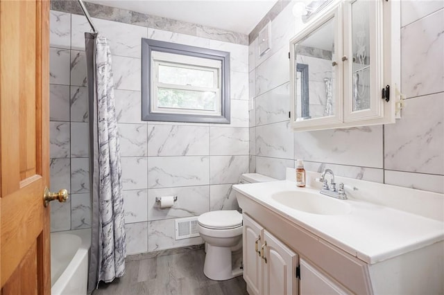 77 Chad Cir, Greece, NY 14616 - full bathroom featuring tile walls, vanity, and shower / tub combo with curtain