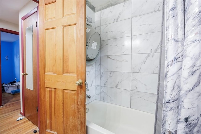 77 Chad Cir, Greece, NY 14616 - bathroom featuring wood finished floors and shower / bath combination with curtain
