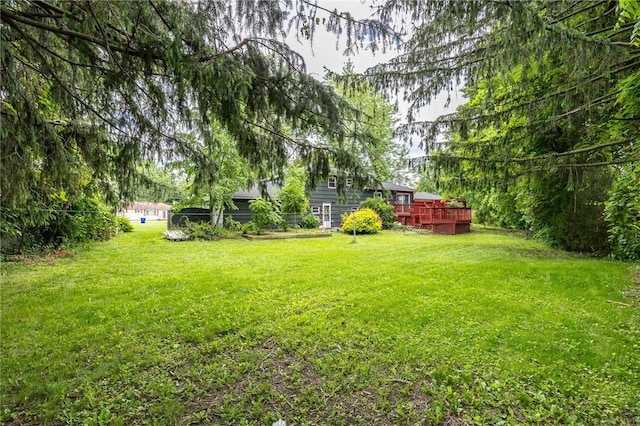 77 Chad Cir, Greece, NY 14616 - view of grassy yard with a wooden deck