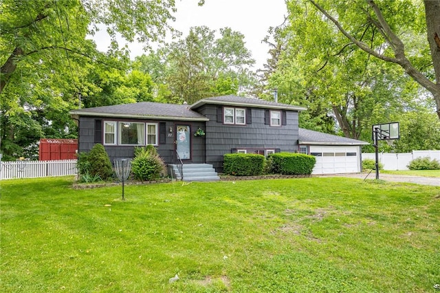 77 Chad Cir, Greece, NY 14616 - tri-level home with driveway, an attached garage, and a shingled roof