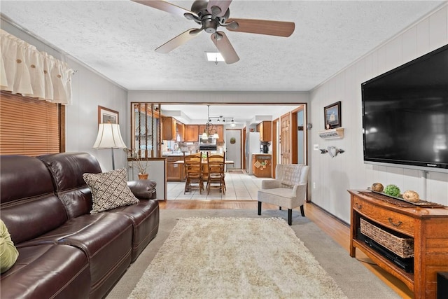 133 Parklands Dr, Greece, NY 14616 - living room with a textured ceiling, a ceiling fan, and ornamental molding