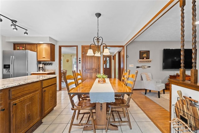 133 Parklands Dr, Greece, NY 14616 - dining area featuring light tile patterned flooring and a chandelier