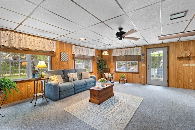 133 Parklands Dr, Greece, NY 14616 - living area with carpet floors, wooden walls, a ceiling fan, and a drop ceiling