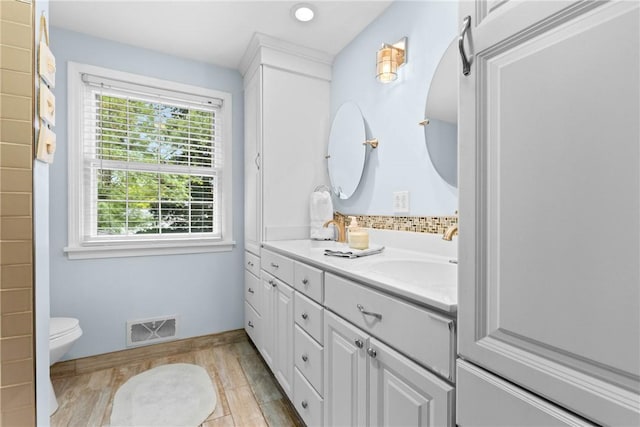 133 Parklands Dr, Greece, NY 14616 - full bath with double vanity, wood finished floors, and recessed lighting