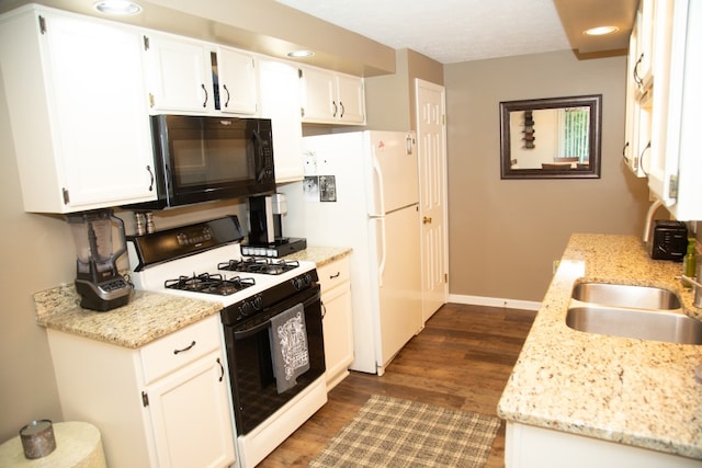 47 Flower Dale Cir, Greece, NY 14626 - kitchen featuring gas stove, black microwave, freestanding refrigerator, dark wood finished floors, and white cabinetry