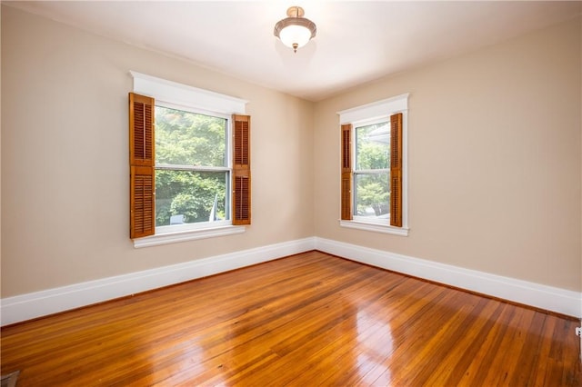 34 Shepard St, Rochester, NY 14620 - empty room with hardwood / wood-style flooring and healthy amount of natural light
