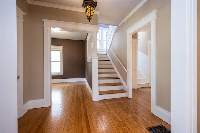34 Shepard St, Rochester, NY 14620 - staircase with wood-type flooring, plenty of natural light, and ornamental molding