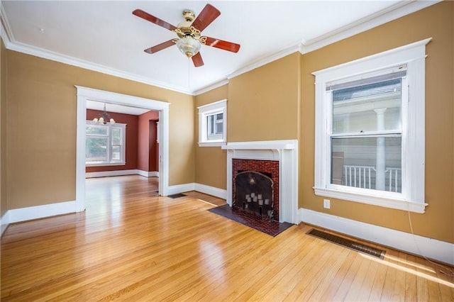 34 Shepard St, Rochester, NY 14620 - unfurnished living room featuring light wood-type flooring, a chandelier, ornamental molding, a fireplace with flush hearth, and ceiling fan