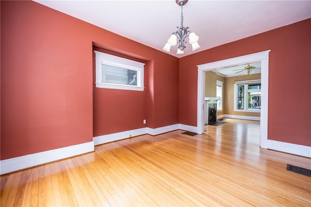 34 Shepard St, Rochester, NY 14620 - unfurnished room with a chandelier and light wood finished floors