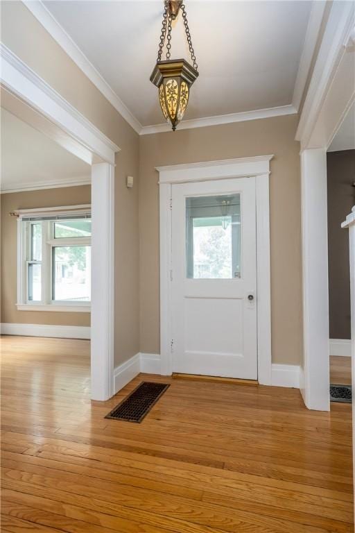34 Shepard St, Rochester, NY 14620 - foyer entrance featuring wood finished floors, healthy amount of natural light, and crown molding