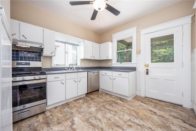 34 Shepard St, Rochester, NY 14620 - kitchen featuring appliances with stainless steel finishes, under cabinet range hood, dark countertops, a ceiling fan, and white cabinetry