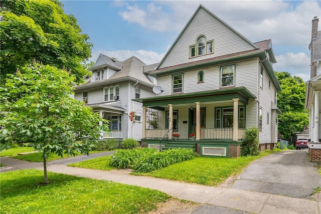 34 Shepard St, Rochester, NY 14620 - traditional style home featuring a porch and a front lawn