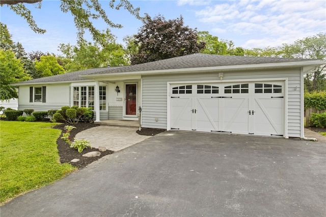 38 Moroa Dr, Irondequoit, NY 14622 - view of front of property with asphalt driveway, an attached garage, and a front yard