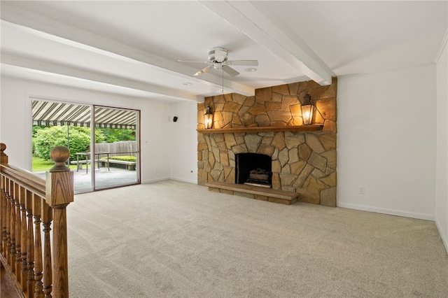38 Moroa Dr, Irondequoit, NY 14622 - unfurnished living room with carpet flooring, beam ceiling, a ceiling fan, and a stone fireplace