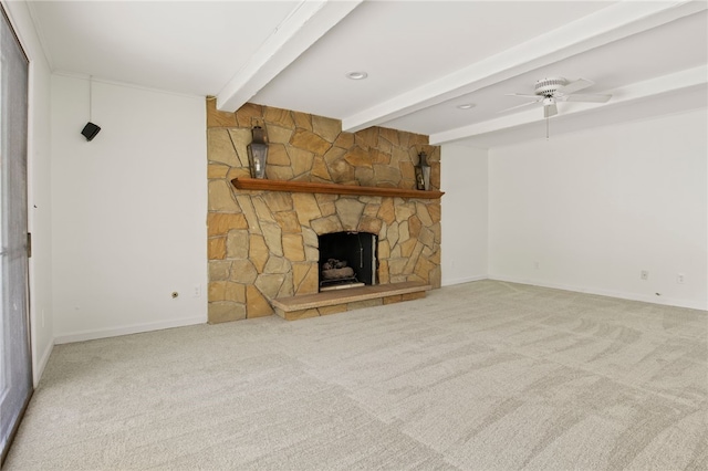 38 Moroa Dr, Irondequoit, NY 14622 - unfurnished living room featuring beamed ceiling, carpet flooring, ceiling fan, and a stone fireplace