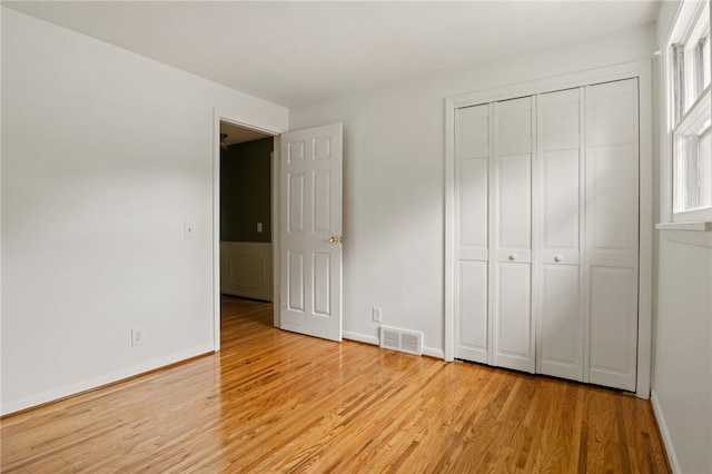 38 Moroa Dr, Irondequoit, NY 14622 - unfurnished bedroom with light wood-style floors and a closet