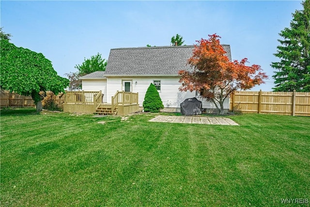 1558 Youngstown Wilson Rd, Porter, NY 14174 - back of house featuring a deck, a fenced backyard, a patio, and a shingled roof