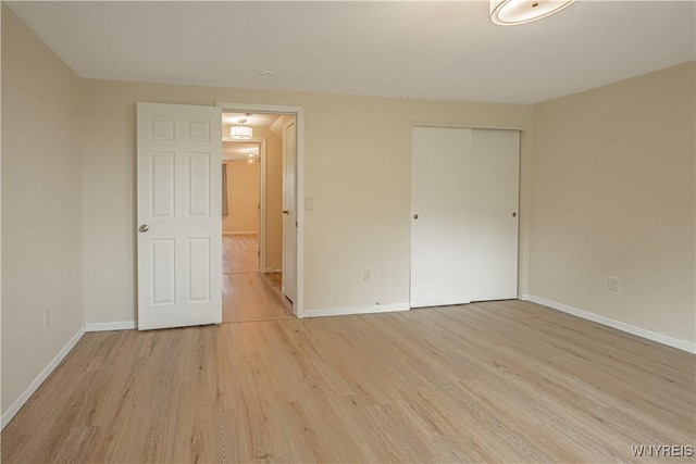 1558 Youngstown Wilson Rd, Porter, NY 14174 - unfurnished bedroom featuring light wood-style floors and a closet