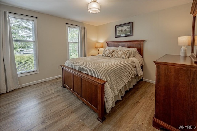 1558 Youngstown Wilson Rd, Porter, NY 14174 - bedroom featuring light wood-style flooring and baseboards