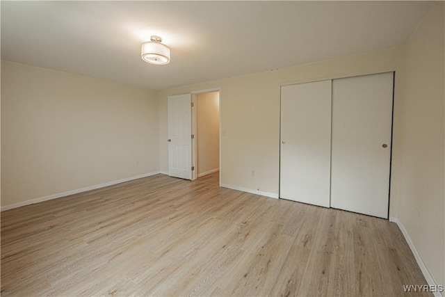 1558 Youngstown Wilson Rd, Porter, NY 14174 - unfurnished bedroom with light wood-style floors and a closet