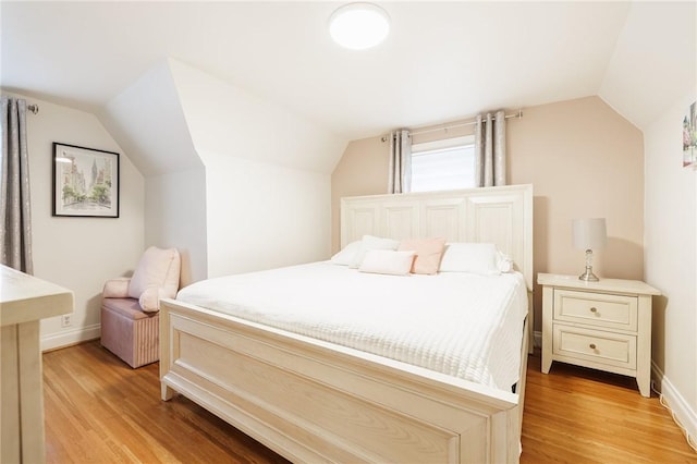 25 Kiniry Dr, Irondequoit, NY 14609 - bedroom featuring vaulted ceiling and light wood finished floors