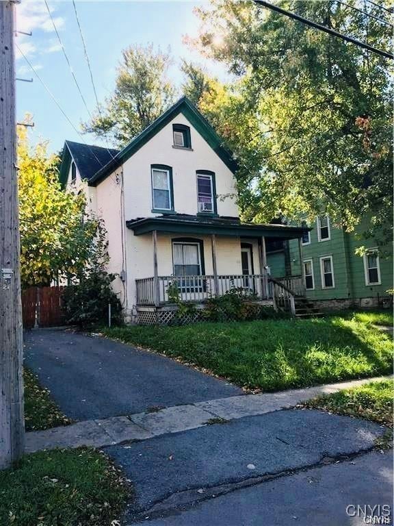 732 Leray St, Watertown City, NY 13601 - view of front of house with a porch and stucco siding
