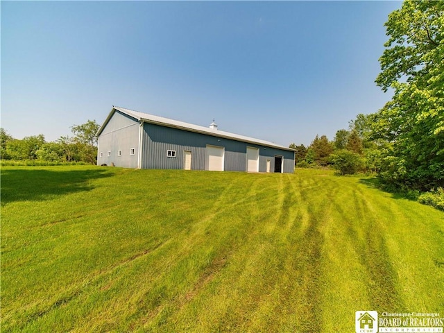 5030 Rte 430, Ellery, NY 14712 - rear view of property featuring a yard, an outdoor structure, a garage, and an outbuilding