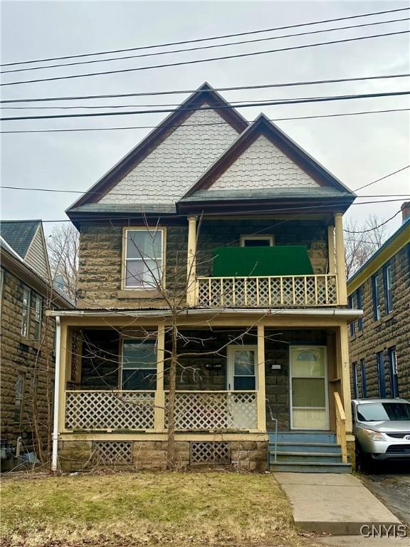 7 Rand St, German Flatts, NY 13357 - view of front facade featuring a balcony and a porch