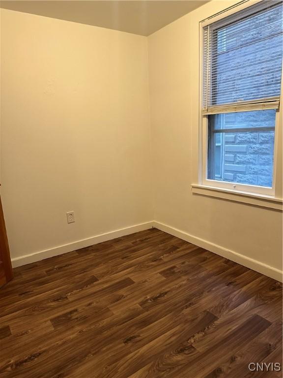 7 Rand St, German Flatts, NY 13357 - spare room featuring baseboards and dark wood-style floors