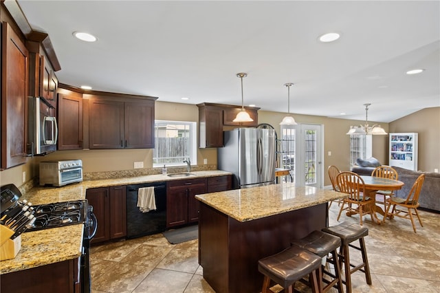 1258 State Rd, Webster, NY 14580 - kitchen with black appliances, plenty of natural light, a kitchen bar, a kitchen island, and recessed lighting