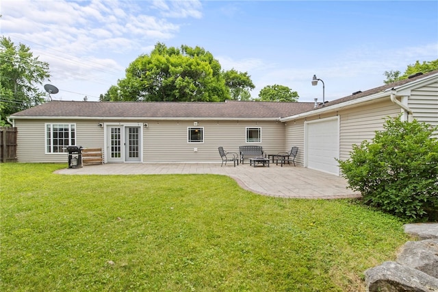 1258 State Rd, Webster, NY 14580 - back of house featuring a patio area, a garage, and french doors