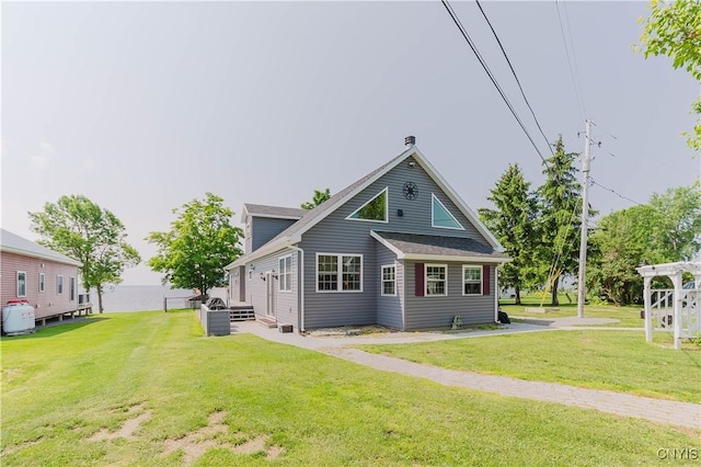 6938 Klock Rd, Lyme, NY 13693 - rear view of property featuring a lawn