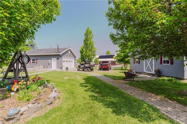6938 Klock Rd, Lyme, NY 13693 - view of grassy yard with an outdoor structure and a garage