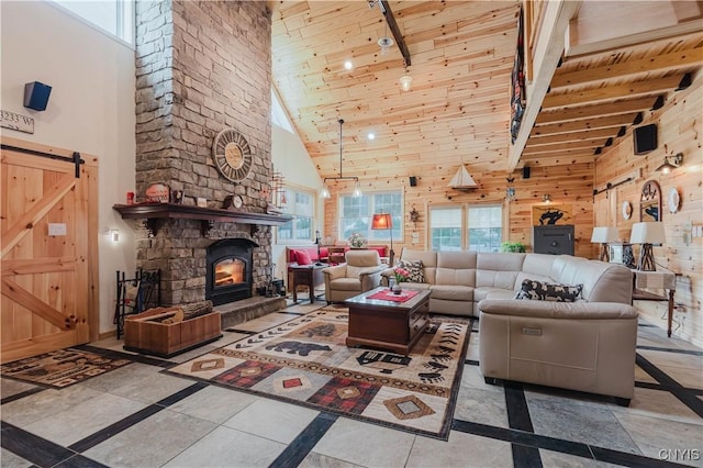 6938 Klock Rd, Lyme, NY 13693 - living area featuring inlaid floor details, high vaulted ceiling, a barn door, plenty of natural light, and a wood ceiling with exposed beams