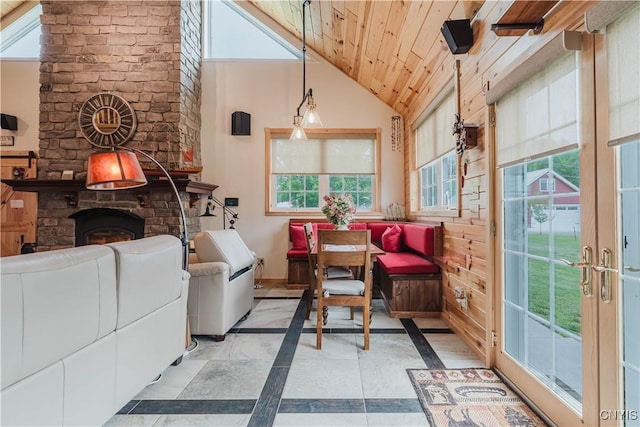 6938 Klock Rd, Lyme, NY 13693 - living area with inlaid floor details, wood ceiling, and high vaulted ceiling