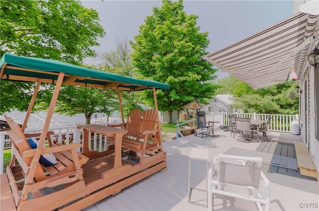 6938 Klock Rd, Lyme, NY 13693 - wooden terrace featuring outdoor dining space