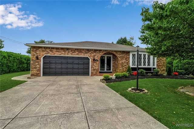 6182 Townline Rd, Wheatfield, NY 14094 - ranch-style home with concrete driveway, brick siding, a front yard, and a garage