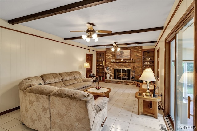 6182 Townline Rd, Wheatfield, NY 14094 - living room with light tile patterned floors, beam ceiling, a ceiling fan, a brick fireplace, and built in features