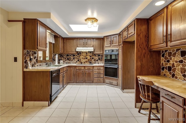 6182 Townline Rd, Wheatfield, NY 14094 - kitchen featuring black appliances, under cabinet range hood, backsplash, and brown cabinets
