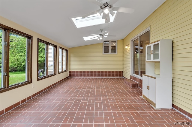 6182 Townline Rd, Wheatfield, NY 14094 - unfurnished sunroom featuring wooden walls, a skylight, brick patterned flooring, and lofted ceiling