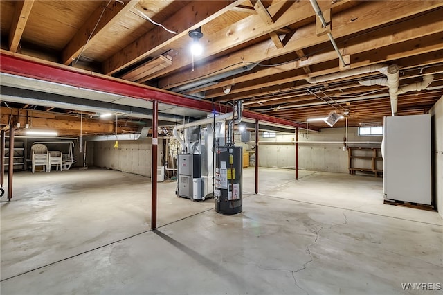 6182 Townline Rd, Wheatfield, NY 14094 - below grade area with gas water heater, freestanding refrigerator, and heating unit
