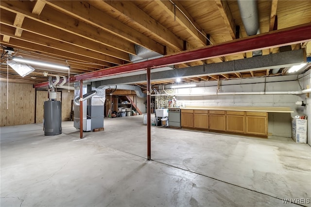 6182 Townline Rd, Wheatfield, NY 14094 - unfinished basement featuring water heater, heating unit, and independent washer and dryer