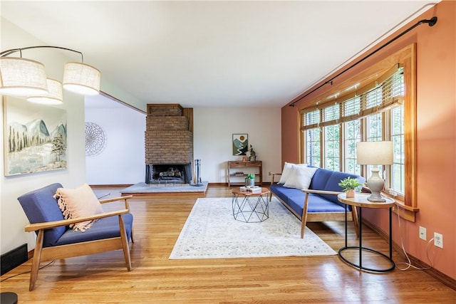 16 Clearview Dr, Henrietta, NY 14534 - living area featuring wood finished floors and a fireplace