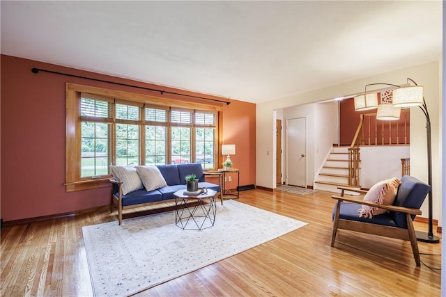 16 Clearview Dr, Henrietta, NY 14534 - living room featuring stairway and light wood finished floors