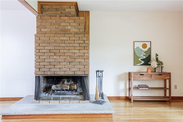 16 Clearview Dr, Henrietta, NY 14534 - detailed view of wood finished floors and a brick fireplace