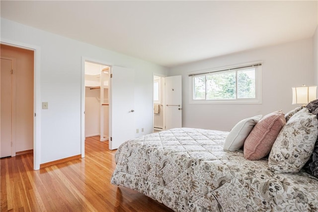 16 Clearview Dr, Henrietta, NY 14534 - bedroom with light wood-style floors, a spacious closet, and a closet