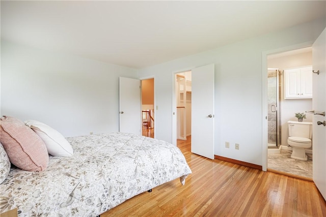 16 Clearview Dr, Henrietta, NY 14534 - bedroom with light wood finished floors, a spacious closet, and ensuite bath