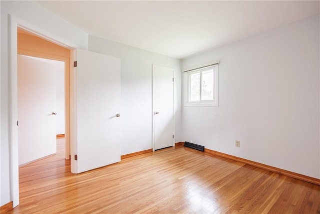 16 Clearview Dr, Henrietta, NY 14534 - unfurnished bedroom featuring light wood-style flooring and baseboards