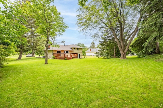 16 Clearview Dr, Henrietta, NY 14534 - view of green lawn with a wooden deck