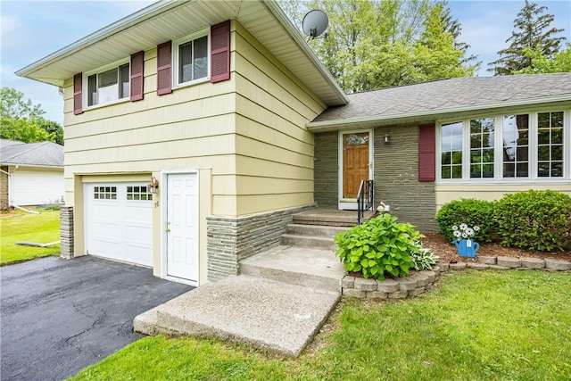 16 Clearview Dr, Henrietta, NY 14534 - tri-level home featuring an attached garage, driveway, and a front yard